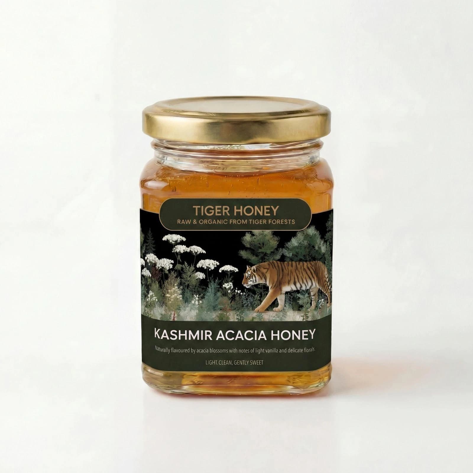 Studio photograph of a glass jar of pale golden Kashmir Acacia Honey with white acacia blossoms