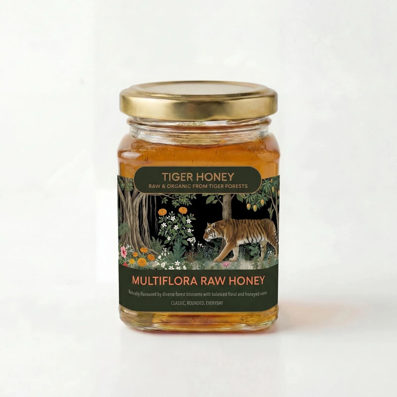Studio photograph of a glass jar of rich golden Multiflora Raw Honey surrounded by small wildflowers